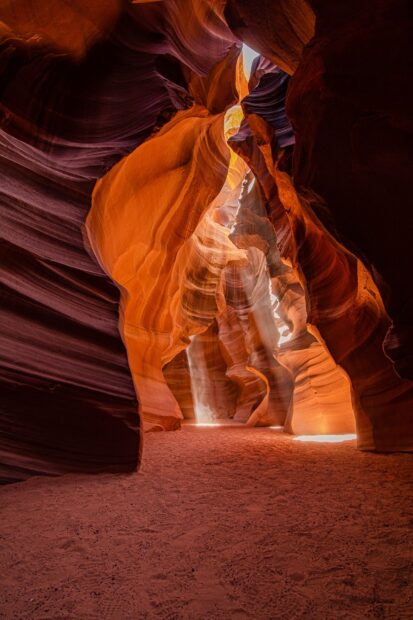 Stunning Antelope Canyon rock formations illuminated by natural light beams in a narrow desert canyon