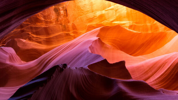 Smooth natural rock formations in vibrant colors at Antelope Canyon