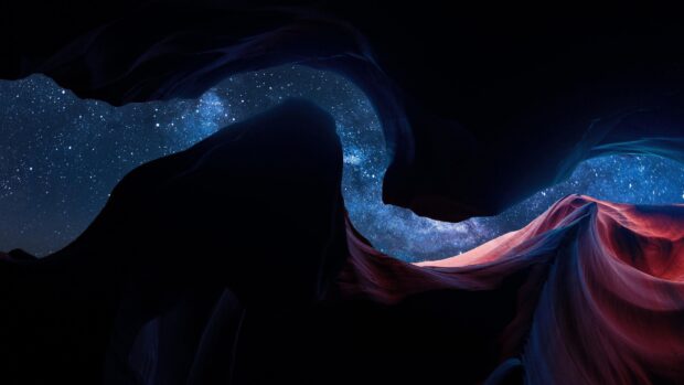 Stunning natural rock formations of Antelope Canyon under a starry night sky