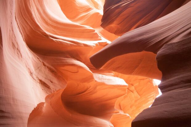 Smooth orange sandstone formations inside Antelope Canyon