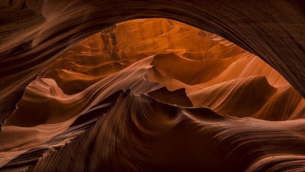 Smooth rock formations inside Antelope Canyon with rich orange colors