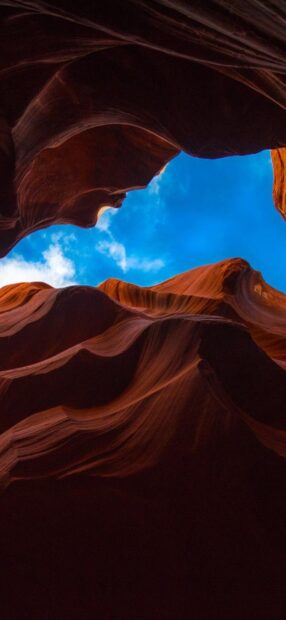 Stunning Antelope Canyon rock formations under the bright blue sky