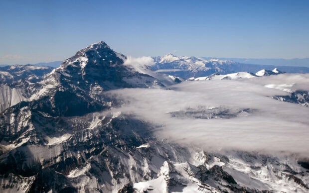 Argentina Wallpaper 2K Desktop A snow covered mountain range in Argentina with clouds drifting over the peaks