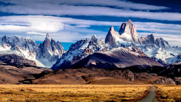 Snowy mountain range in Argentina with clear sky and rugged landscape