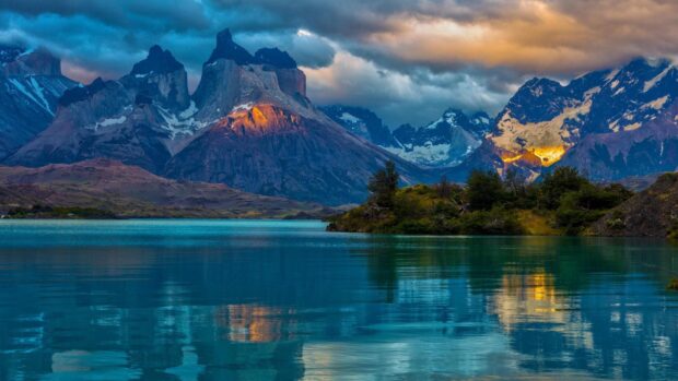 Stunning mountain scenery with Argentina reflecting on calm lake water at sunset