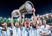 Argentina team celebrating with the trophy after winning the football tournament