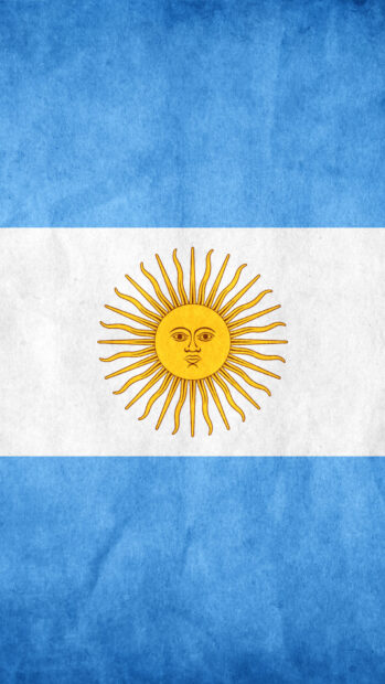 The flag of Argentina with the Sun of May symbol on a textured background
