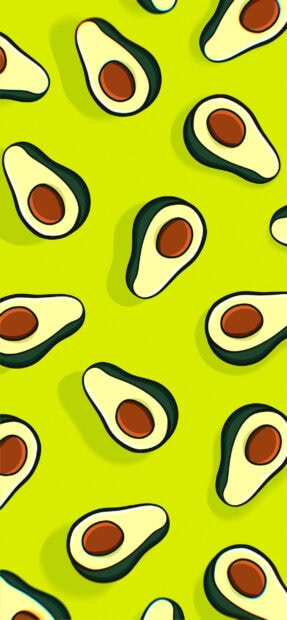 Fresh avocado pattern with bright green background and seeds in the center