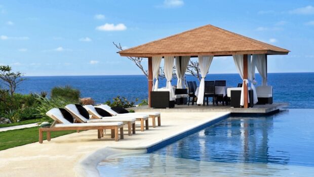 Relaxing Bali resort with lounge chairs and ocean view in Bali