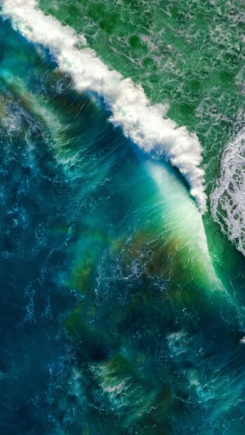 Aerial view of Bali ocean waves crashing with vibrant colors and natural beauty