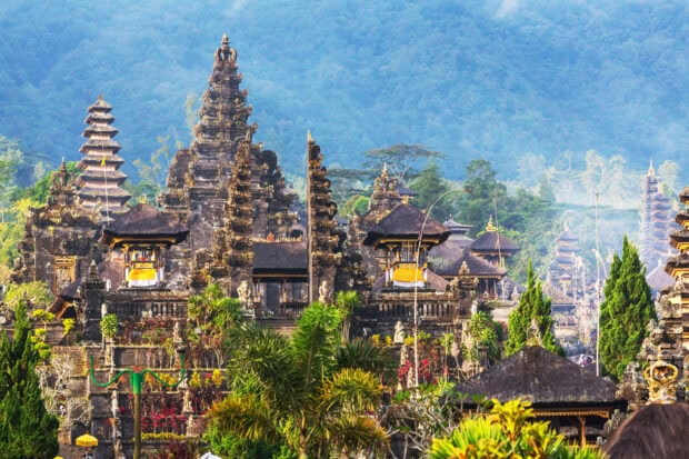 Traditional Balinese architecture surrounded by lush greenery in Bali