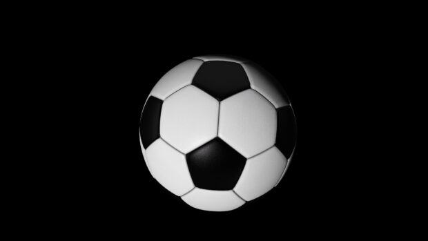 A classic black and white ball on a dark background with a clean design