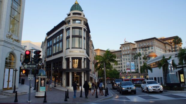 Scenic view of a busy street in Beverly Hills with luxury shops and palm trees