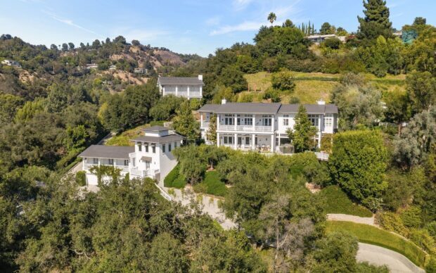 Scenic view of Beverly Hills houses surrounded by lush greenery and hills
