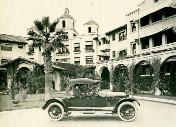 Vintage car with a driver in Beverly Hills architecture scene