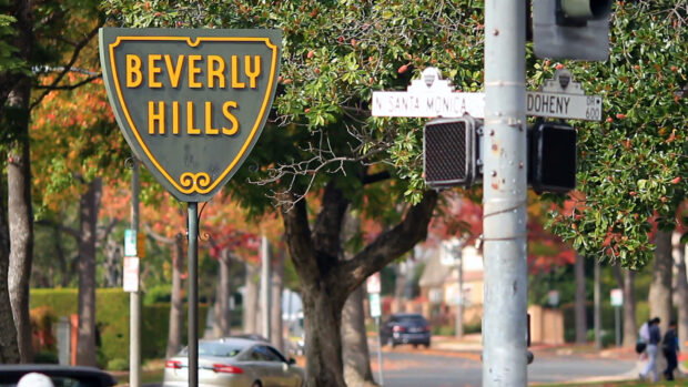 Beverly Hills street sign near Santa Monica and Doheny on a tree lined road