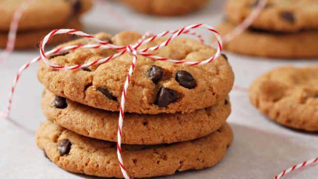 A stack of biscuit tied with a red and white string on a table surface
