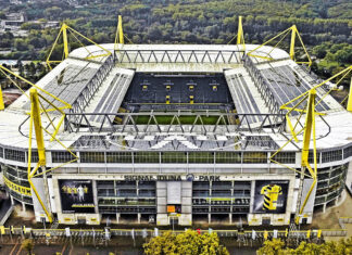 Aerial view of Borussia Dortmund stadium Signal Iduna Park surrounded by trees and urban area
