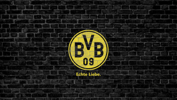 Borussia Dortmund logo on black brick wall representing Borussia Dortmund club