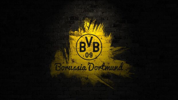 Paint splash with Borussia Dortmund logo on black brick wall background