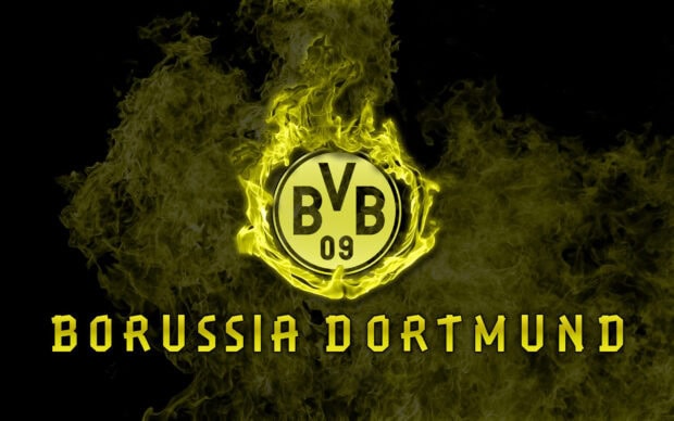 Borussia Dortmund logo surrounded by yellow flames on a black background