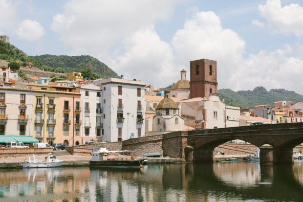 Historic Bosa Italy town with river and old buildings reflecting in water
