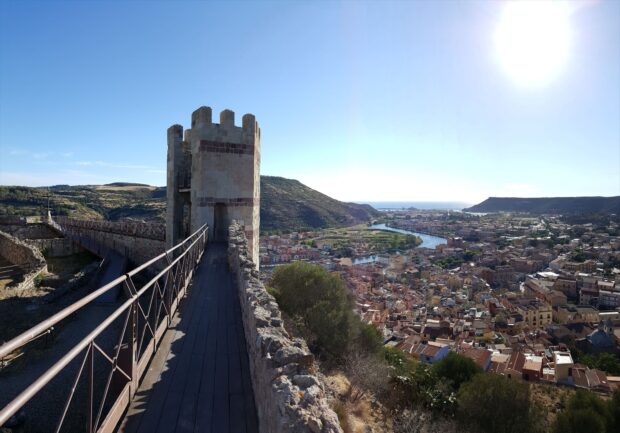 Ancient tower and colorful town landscape in Bosa Italy