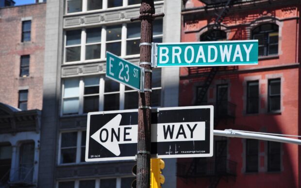 One way street sign at the intersection of Broadway and E 23rd Street in the city