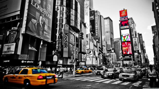 Iconic Broadway street scene with yellow taxis and towering buildings in New York City