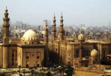 Historic architecture in Cairo Egypt with mosques and urban buildings in the background
