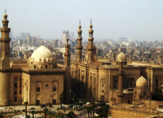 Historic architecture in Cairo Egypt with mosques and urban buildings in the background