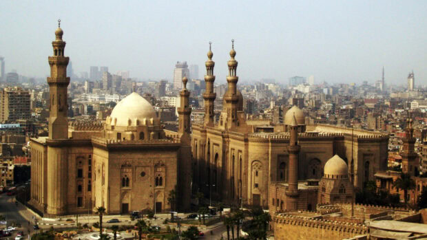 Historic architecture in Cairo Egypt with mosques and urban buildings in the background
