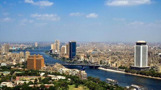 A panoramic view of Cairo Egypt cityscape with the Nile River flowing through the urban area