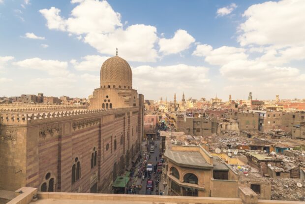Historic Cairo cityscape with ancient architecture and busy streets in Egypt