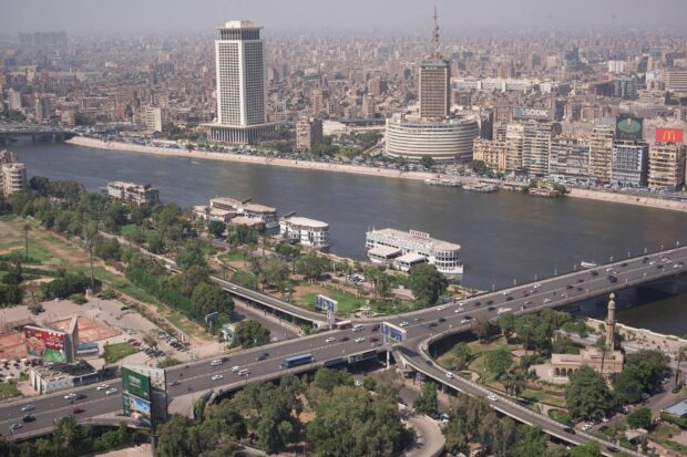 A panoramic view of Cairo with the Nile River and cityscape prominently featuring Cairo Egypt
