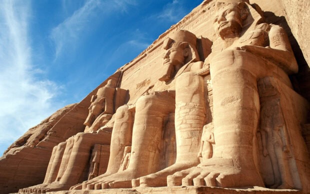 Ancient Egyptian statues carved in rock at Abu Simbel near Cairo Egypt