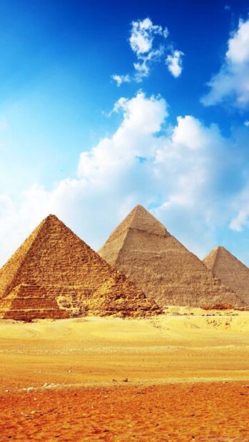 Ancient pyramids under a bright blue sky in Cairo Egypt