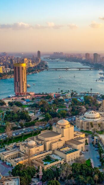 Aerial View Of Cairo Egypt Showing The Nile River And Cityscape At Sunset