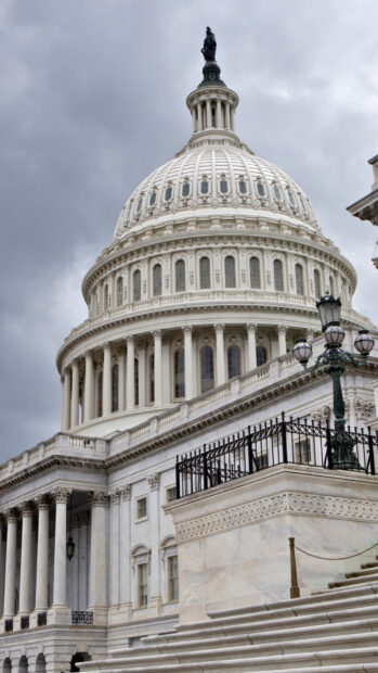 The Capitol Hill dome stands prominently against a cloudy sky in HD quality
