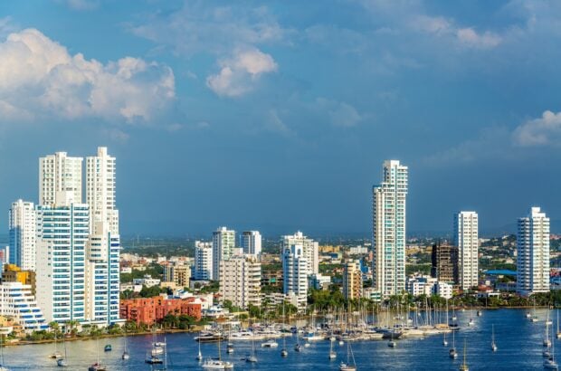 Modern cityscape with tall buildings and marina in Colombia harbor