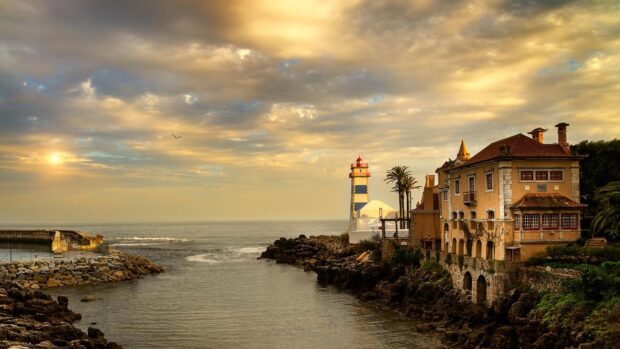 Lighthouse near the coast with a beautiful sunset sky in Colombia