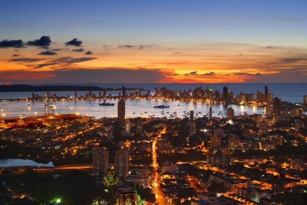 Night cityscape with Colombia skyline and vibrant lights at sunset