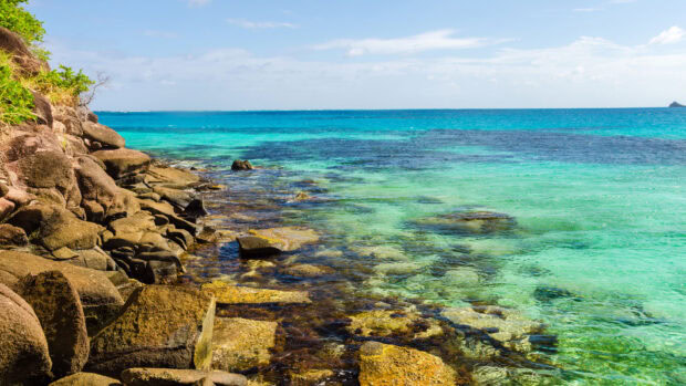 Rocky coastline with clear turquoise waters in Colombia coastline