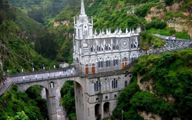 Las Lajas Sanctuary located in Colombia surrounded by lush green mountains