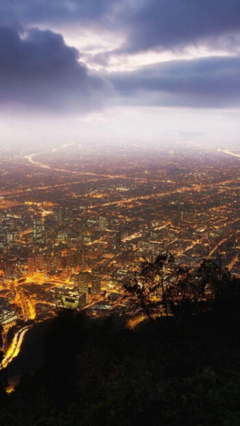 Night view of Colombia city lights under cloudy sky