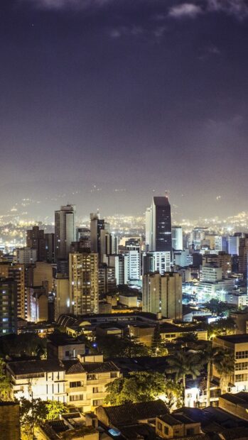 Night view of Colombia cityscape with illuminated buildings and urban lights
