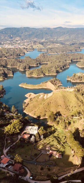 Aerial view of Colombia countryside with river and lush green landscape