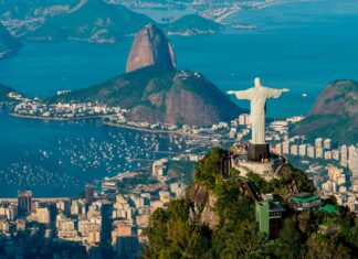A panoramic view of Corcovado Mountain and Christ the Redeemer statue overlooking the city and bay