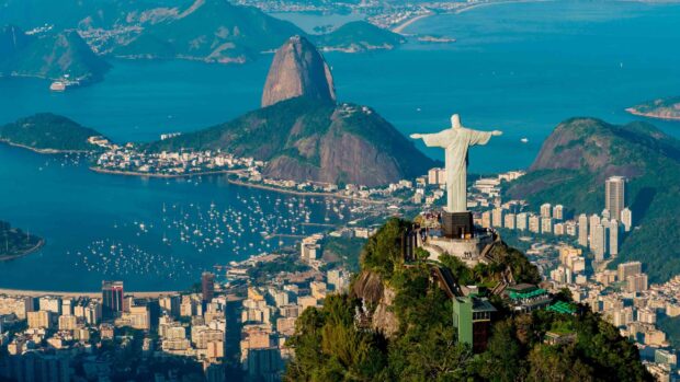 A panoramic view of Corcovado Mountain and Christ the Redeemer statue overlooking the city and bay