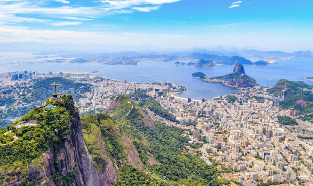 A panoramic view of Corcovado mountain overlooking the city and coastline of Rio de Janeiro